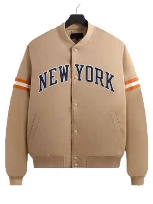 Beige varsity jacket with 'New York' text on a white background