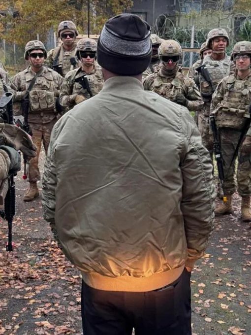 Person in a beige jacket facing a group of soldiers in military gear outdoors.