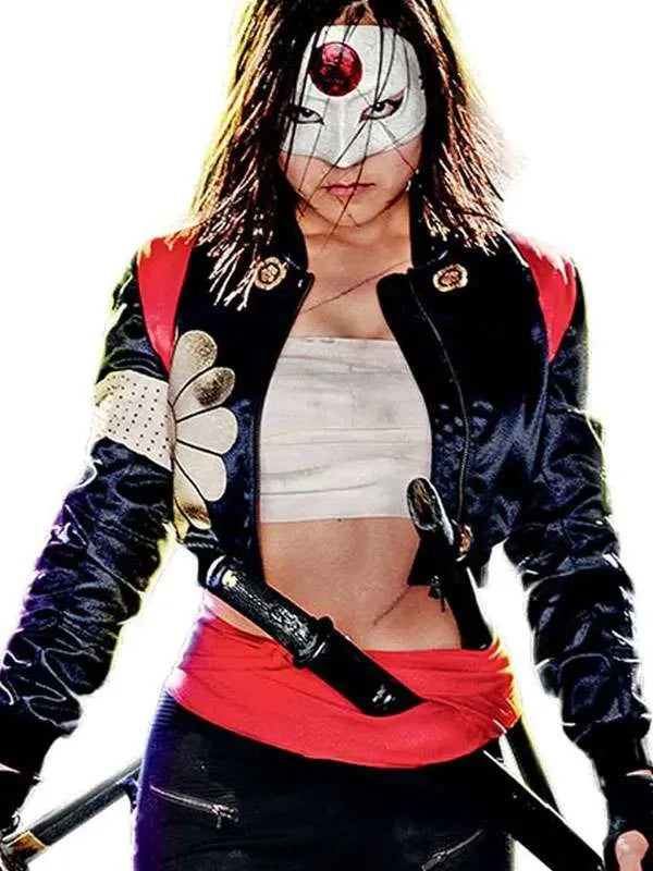 Person wearing a colorful jacket with a white mask featuring a red eye, holding a sword.