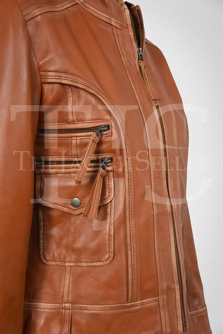 Side view of Women's Genuine Lambskin Leather Jacket, highlighting the sleek fit and functional zippered pockets.