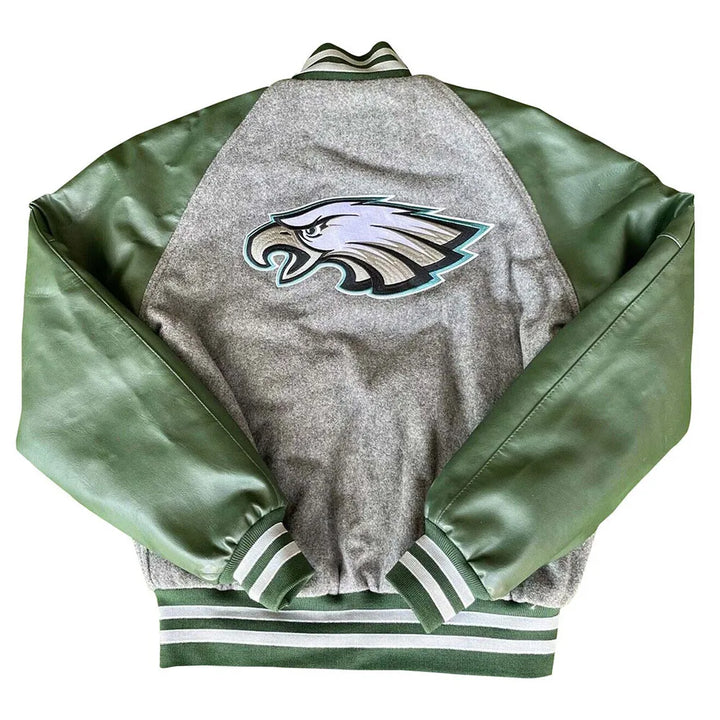 Green and gray varsity jacket with leather sleeves

