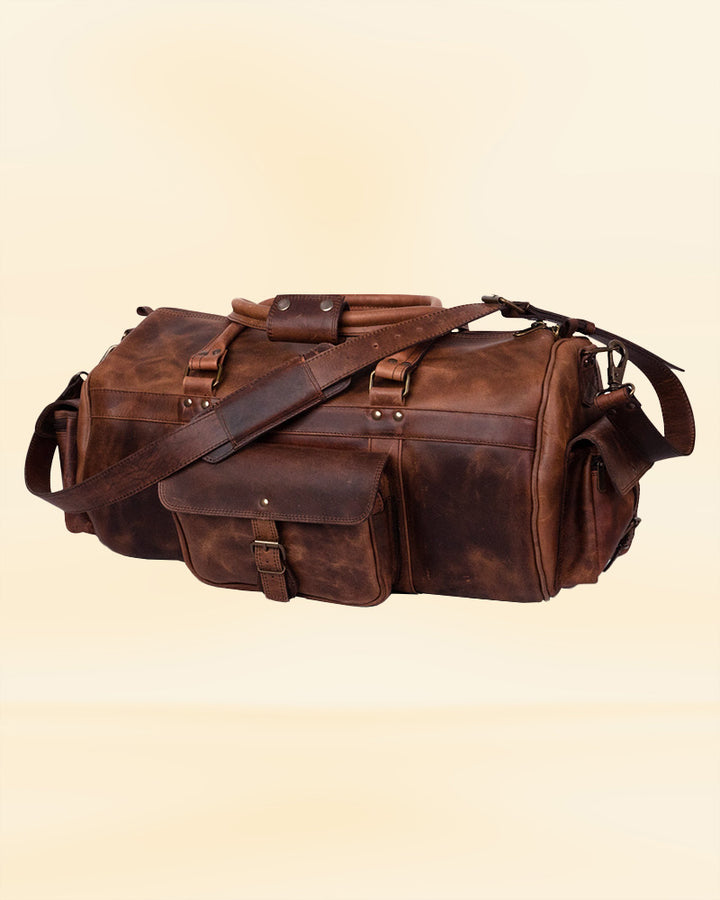 The durable leather finish of our duffle bag, designed for the rigors of American travel