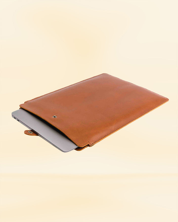 Leather laptop sleeve with a detachable shoulder strap for hands-free carrying