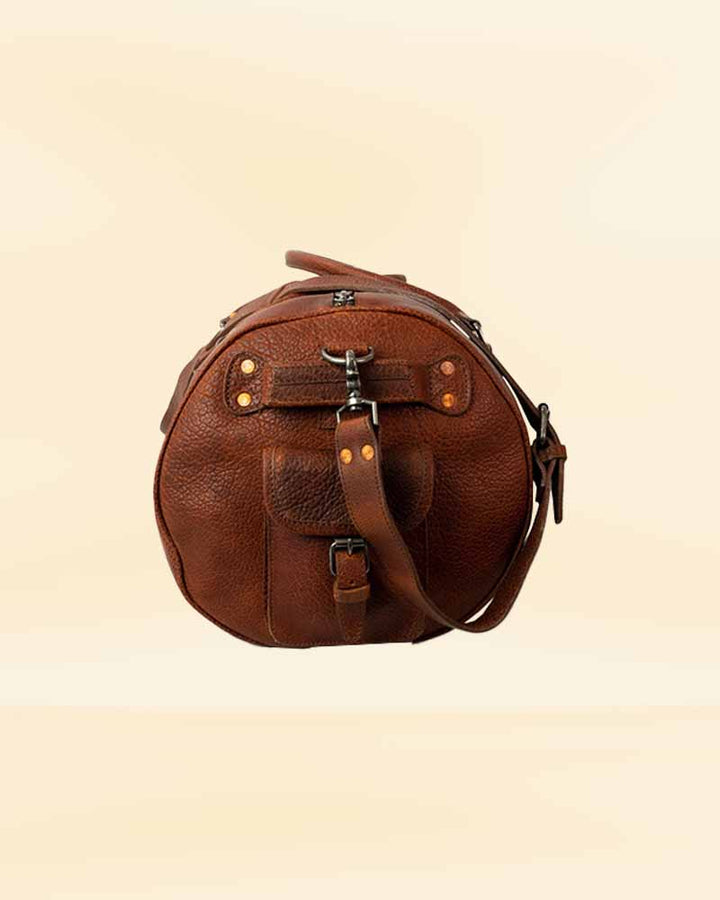 The durable leather finish of our travel duffle bag, designed for the rigors of American travel